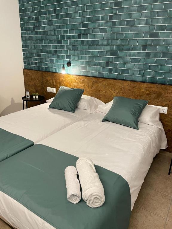 Postel nebo postele na pokoji v ubytování HOTEL ORENETA - Gironella