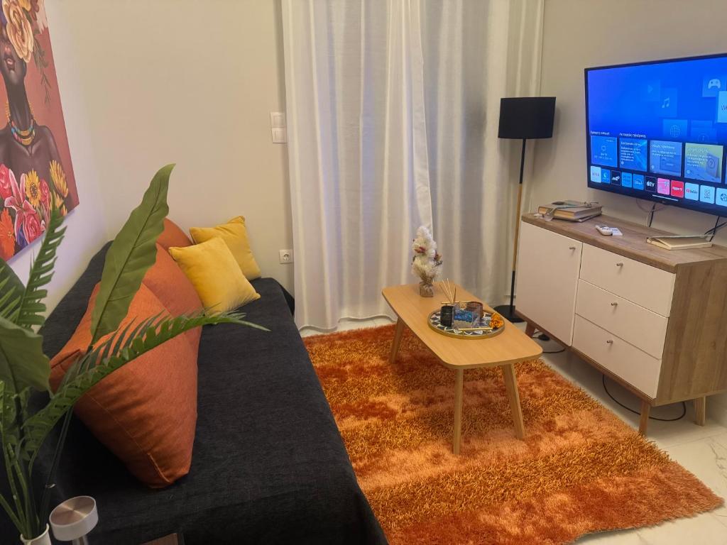 TV a/nebo společenská místnost v ubytování Aquamarine - Beach Flat