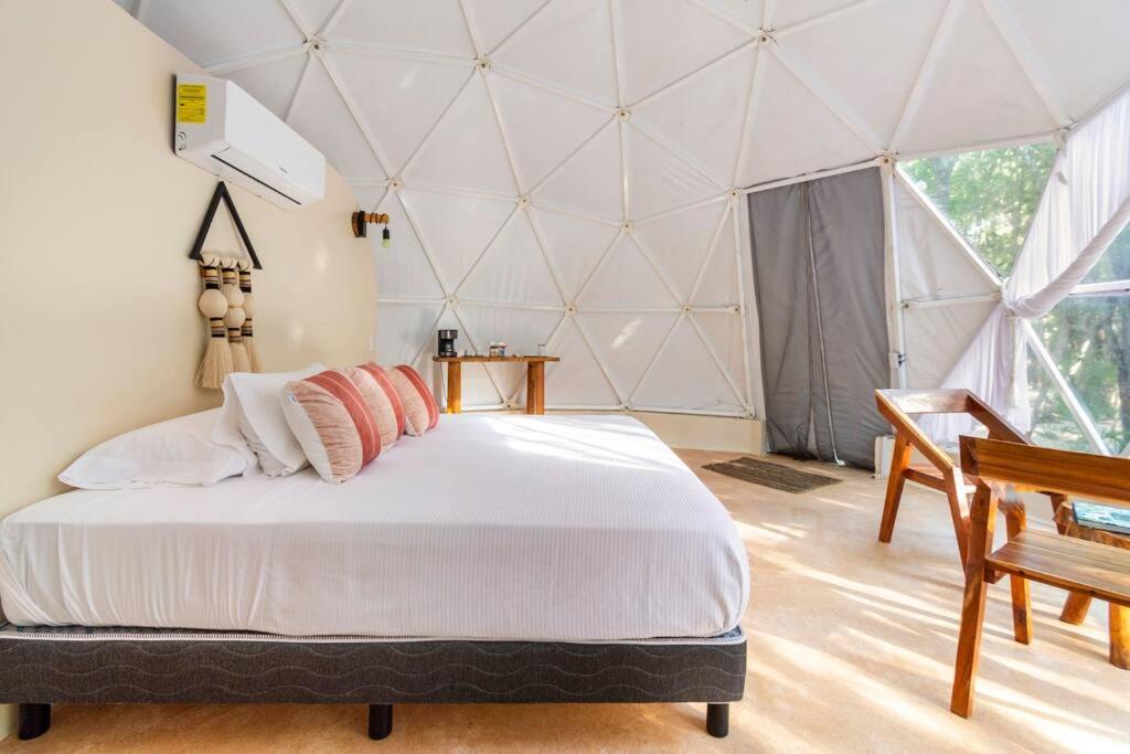 Postel nebo postele na pokoji v ubytování Glamping Mayan Glam