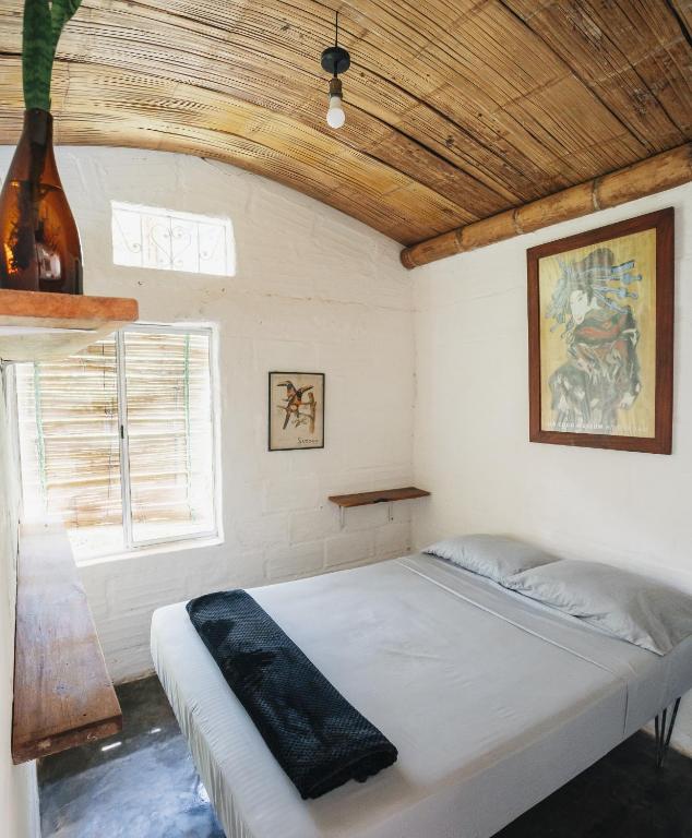 Postel nebo postele na pokoji v ubytování Casa Aves, Refugio Natural Jacaranda