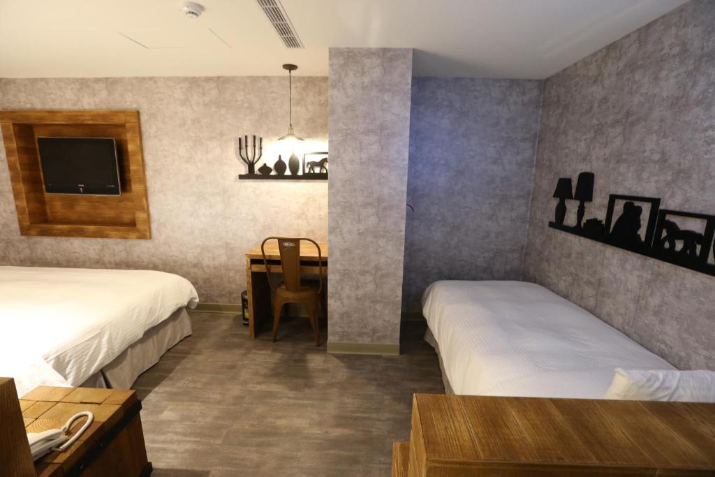 Postel nebo postele na pokoji v ubytování Central Hotel