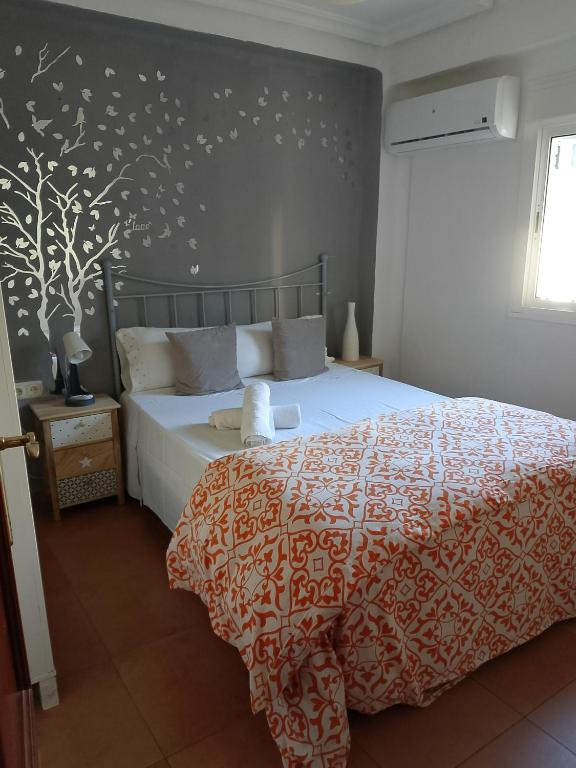 A bed or beds in a room at Santa Justa
