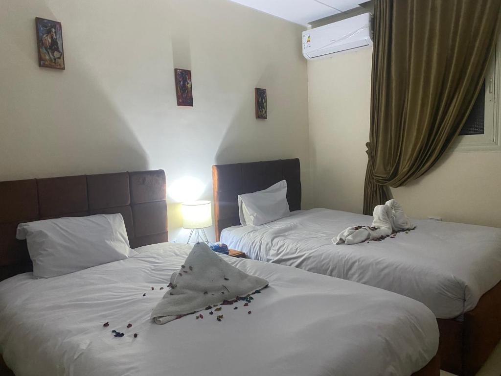 Letto o letti in una camera di Experience Pyramids VIEW