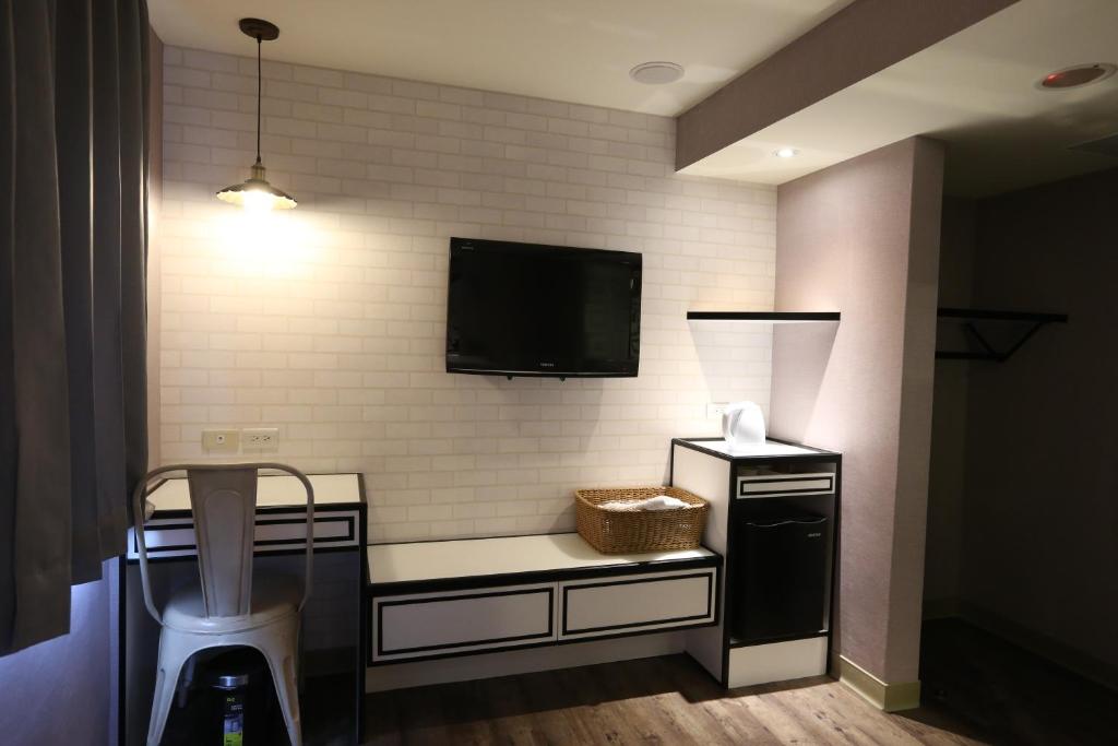 TV a/nebo společenská místnost v ubytování Central Hotel