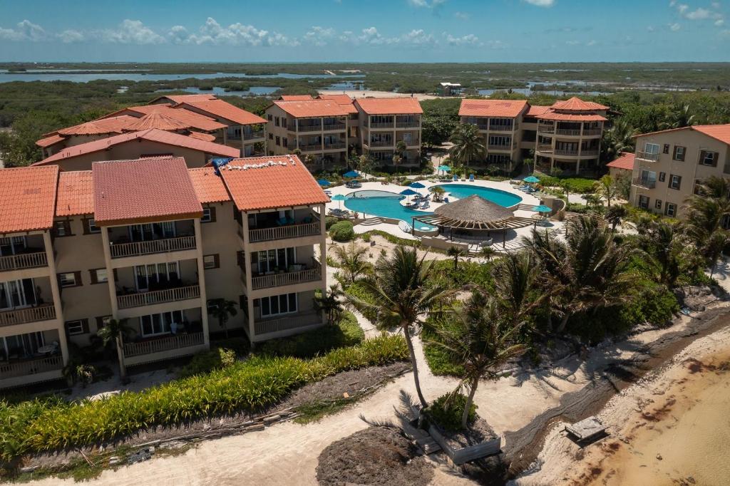 an aerial view of a resort with a swimming pool at Residences at Barrier Reef 1-2C Oceanfront 2 BR by Stay Floreo in San Pedro