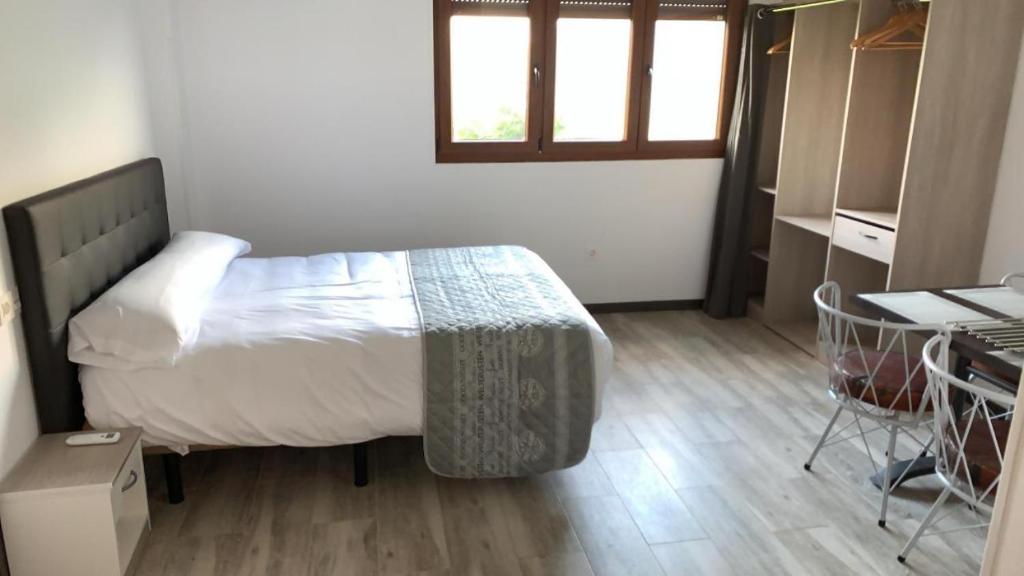 A bed or beds in a room at Mirador de Miranda Apartamentos Rural & Spa Inc