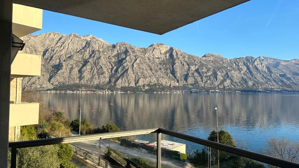 a view of a mountain range from a balcony at Drazn vrt in Kotor