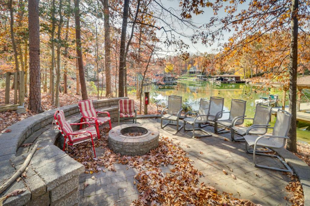 a group of chairs sitting around a fire pit at Waterfront Lake Anna Home Kayaks and Private Dock in Mineral