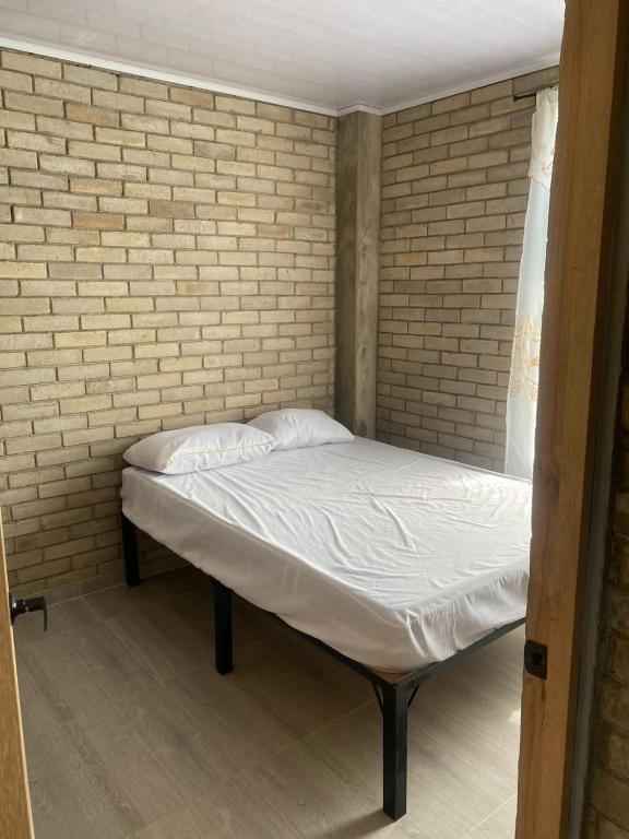 Postel nebo postele na pokoji v ubytování Rincon de charito