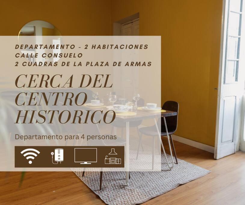 a table with a sign on it in a room at La Casona Consuelo in Arequipa