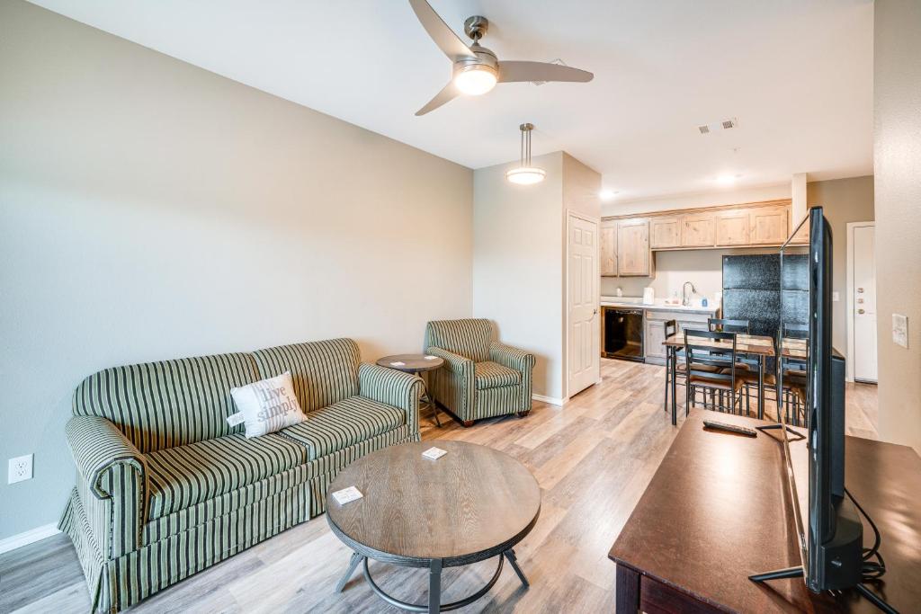 a living room with a couch and a table at Close to Lakes and Museums Bonham Vacation Rental in Bonham