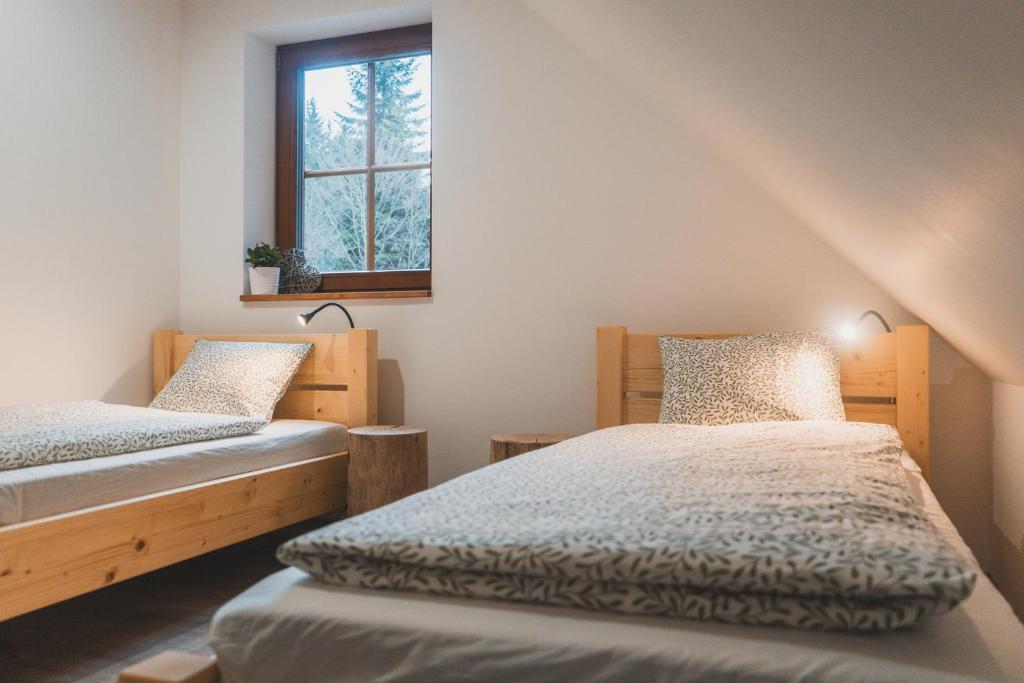 Postel nebo postele na pokoji v ubytování Wellness Chalupa Krajanka