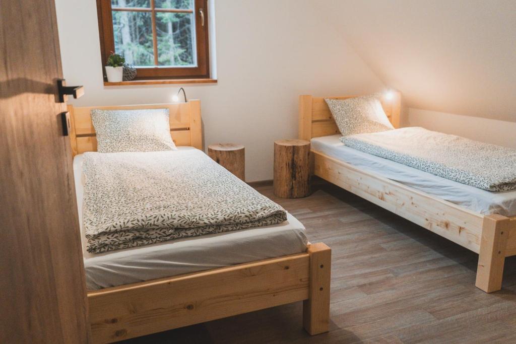 Postel nebo postele na pokoji v ubytování Wellness Chalupa Krajanka