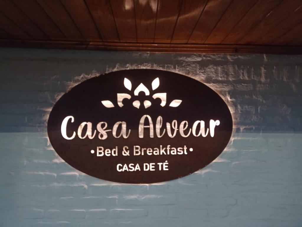 a sign that reads casa aveaver hanging on a wall at Casa Alvear - Bed & Breakfast in Tandil