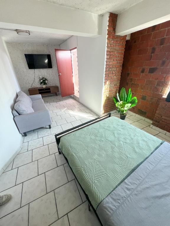 Postel nebo postele na pokoji v ubytování Hotel RJ Querétaro