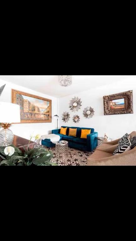 a living room with a couch and a table at Casa Guijas in Guanajuato