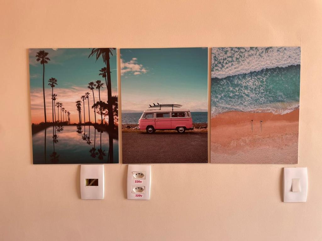 a wall with three pictures of a van on the beach at Pouso 46 - Studios no Santo Antônio Além do Carmo in Salvador