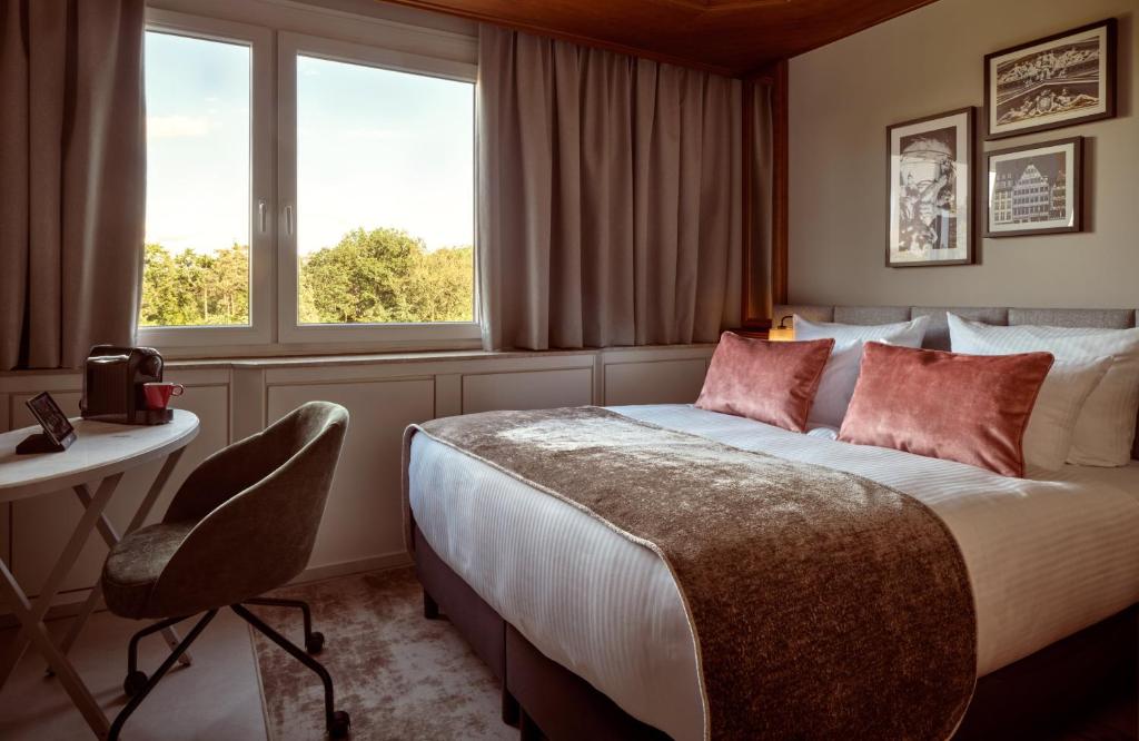 Ένα ή περισσότερα κρεβάτια σε δωμάτιο στο Leonardo Hotel Frankfurt City South