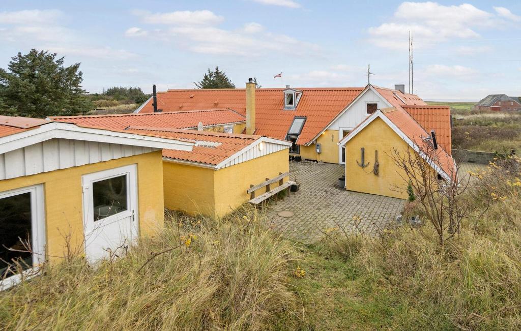 a group of buildings sitting on top of a hill at 3 Bedroom Beautiful Home In Ringkøbing in Ringkøbing
