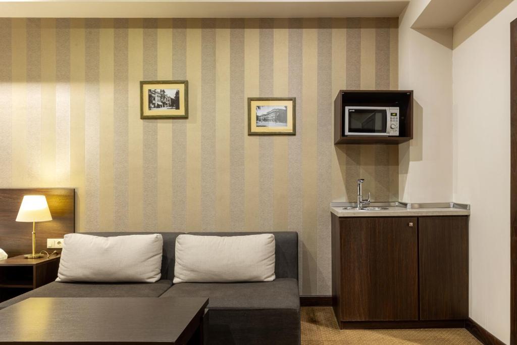 TV a/nebo společenská místnost v ubytování Citrus Hotel
