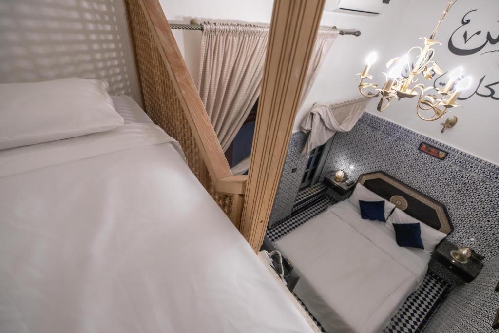 Postel nebo postele na pokoji v ubytování Riad Skilfo