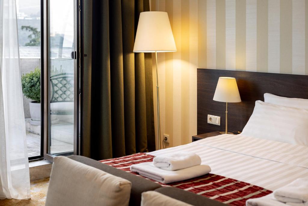 Postel nebo postele na pokoji v ubytování Citrus Hotel