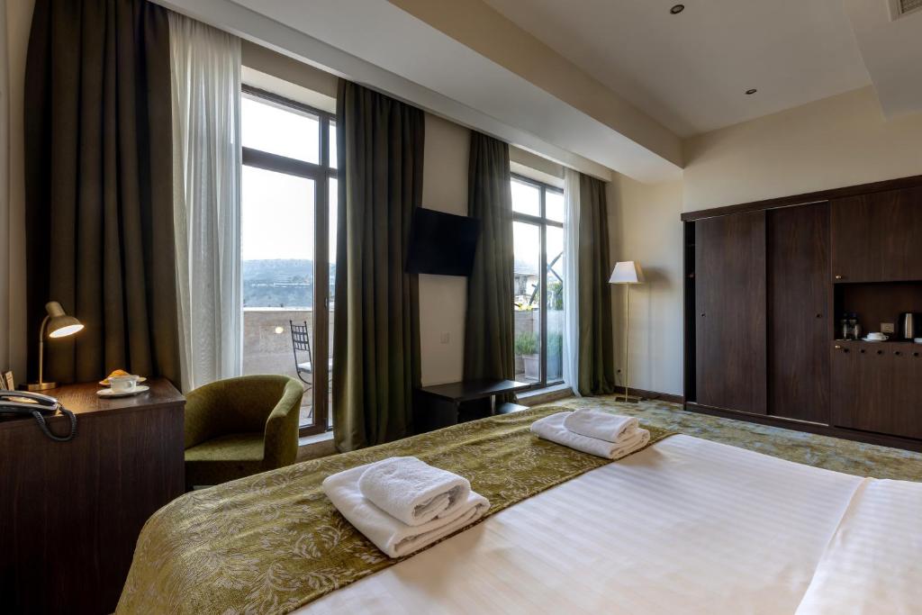 Postel nebo postele na pokoji v ubytování Citrus Hotel