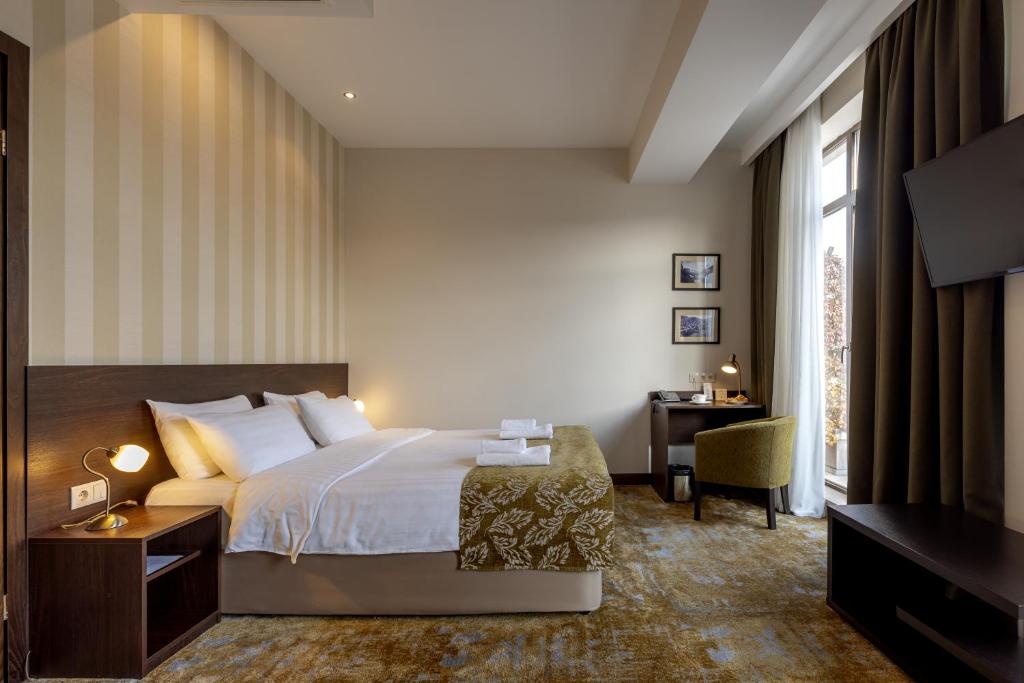 Postel nebo postele na pokoji v ubytování Citrus Hotel