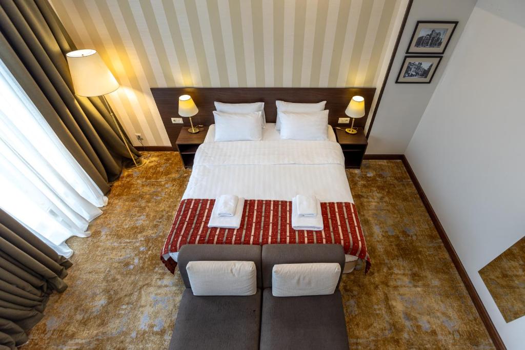 Postel nebo postele na pokoji v ubytování Citrus Hotel