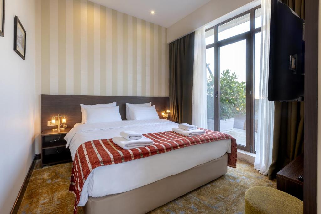 Postel nebo postele na pokoji v ubytování Citrus Hotel