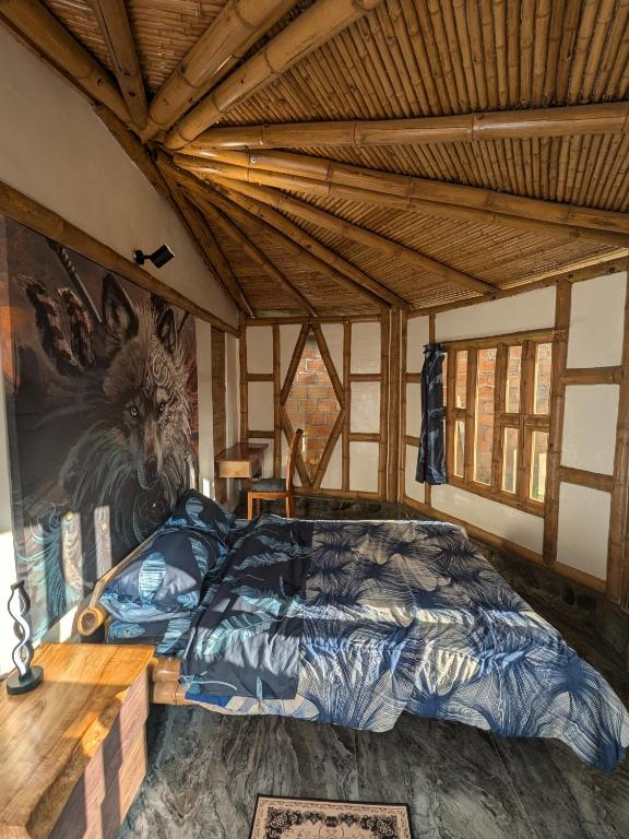 Postel nebo postele na pokoji v ubytování Qinti Quetzal Boutique Guest house y Elixir Bar