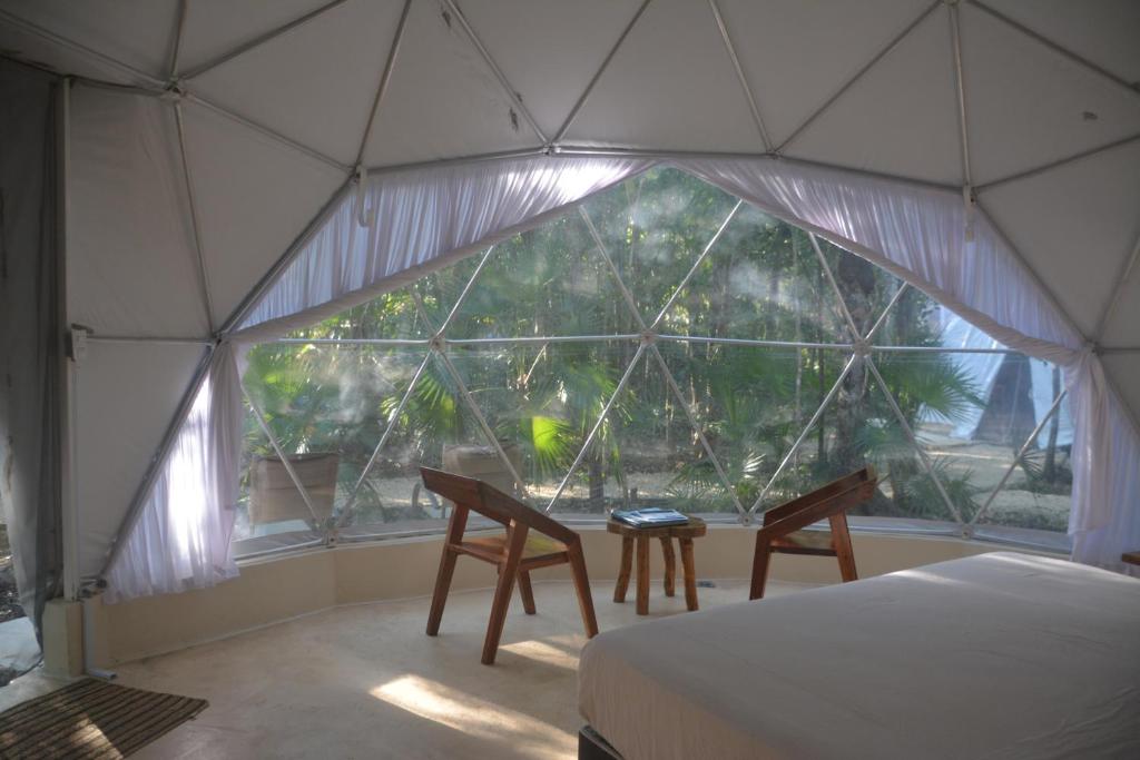 Postel nebo postele na pokoji v ubytování Glamping Mayan Glam