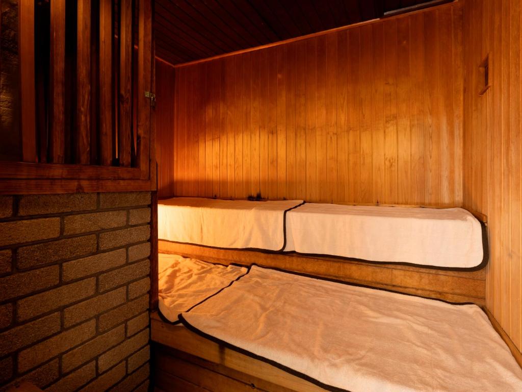 Postel nebo postele na pokoji v ubytování Hotel Sunvalley Fujimi