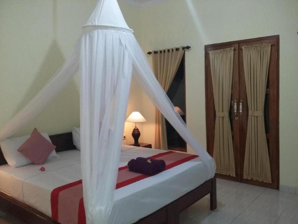 Postel nebo postele na pokoji v ubytování Sudi Guest House