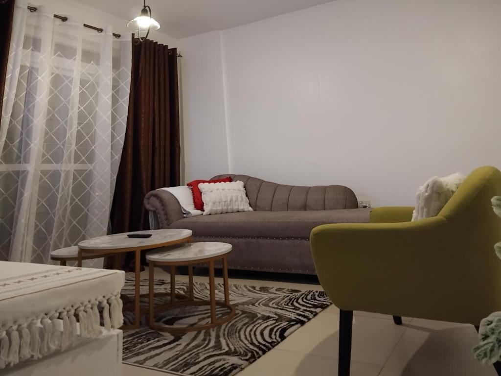 a living room with a couch and a table at Millan home stay Nyali in Mombasa