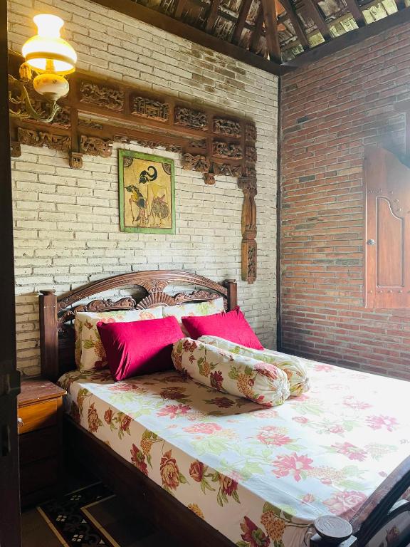 Postel nebo postele na pokoji v ubytování Merapi Eco Bungalow