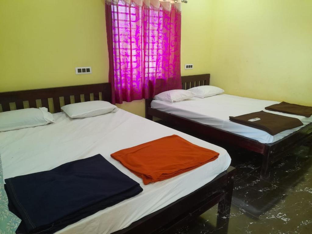 Katil atau katil-katil dalam bilik di Coastal Charm Homestay