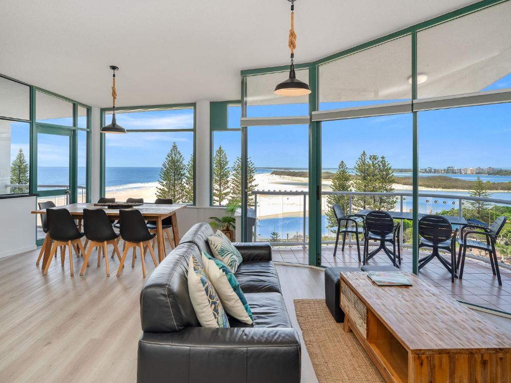 a living room with a couch and a table at Waterview Resort in Caloundra