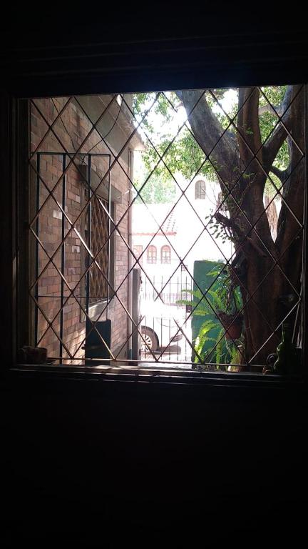 a window with a view of a building at Casa de botellas in Buenos Aires
