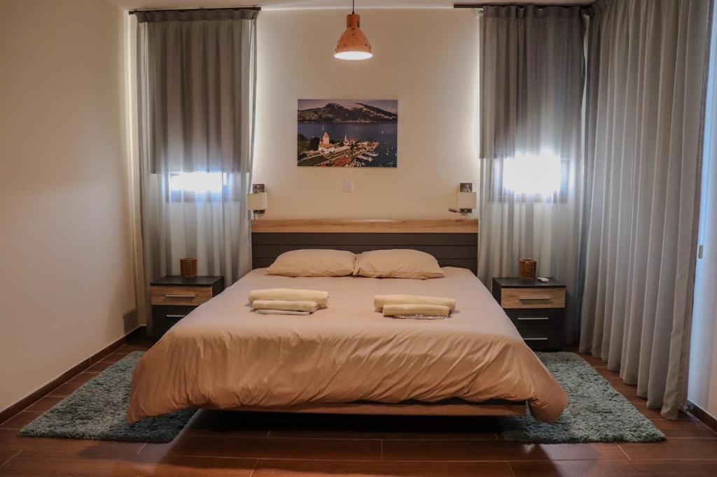 Postel nebo postele na pokoji v ubytování Marios Villa