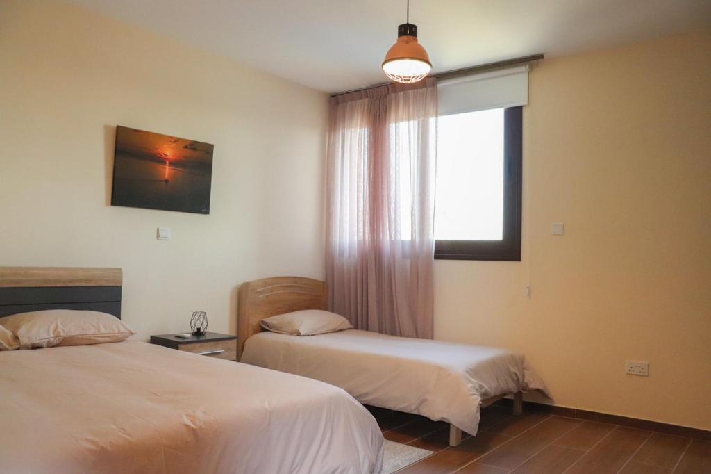 Postel nebo postele na pokoji v ubytování Marios Villa