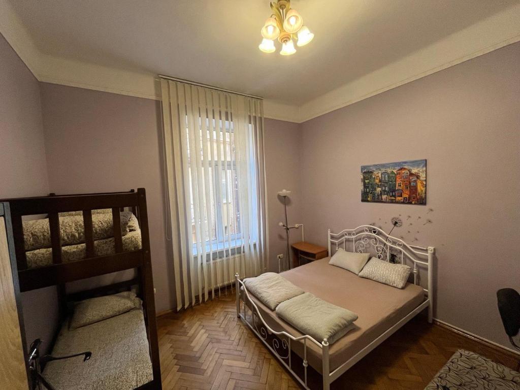 Postel nebo postele na pokoji v ubytování Centrum Hostel
