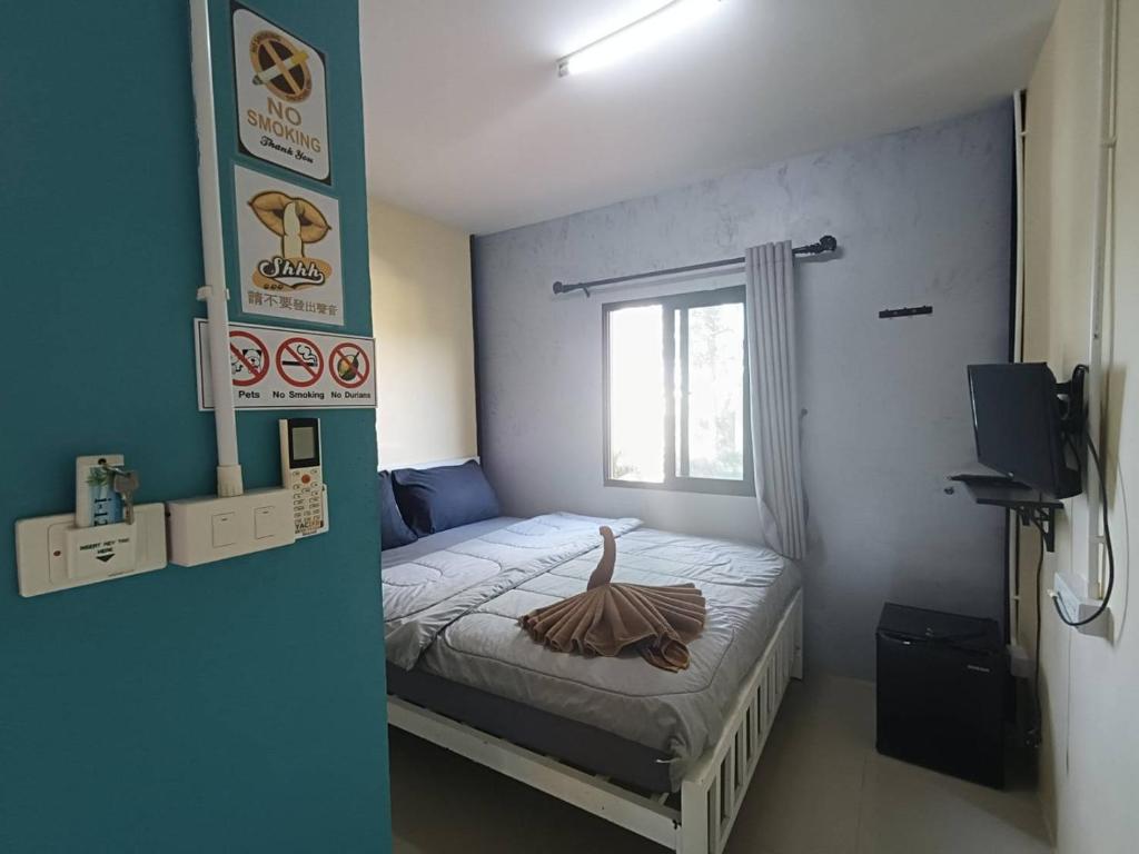 Postel nebo postele na pokoji v ubytování I-Talay Zone Sea