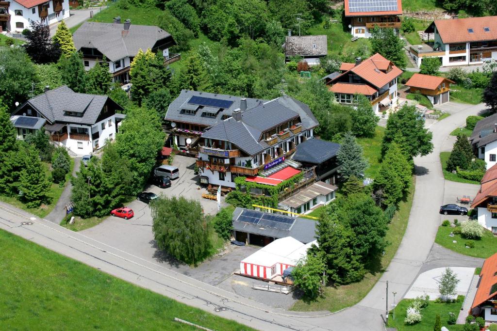 an aerial view of a house in a residential neighborhood at Hotel Dachsberger-Hof in Wittenschwand