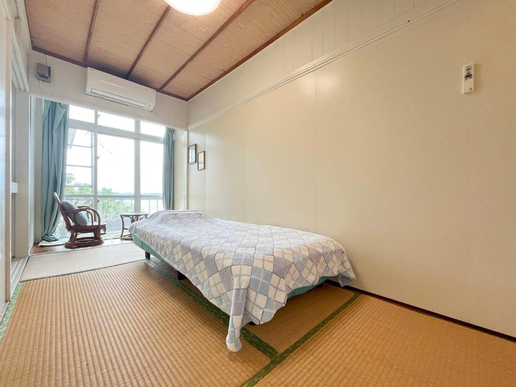 Postel nebo postele na pokoji v ubytování MAETAKAYA しまんちゅ