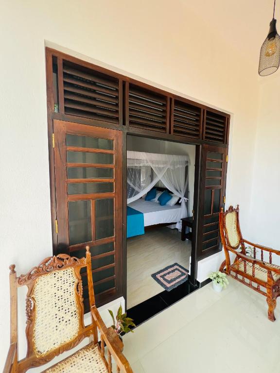 Postel nebo postele na pokoji v ubytování JO Residence - Tangalle