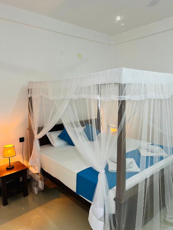 Postel nebo postele na pokoji v ubytování JO Residence - Tangalle