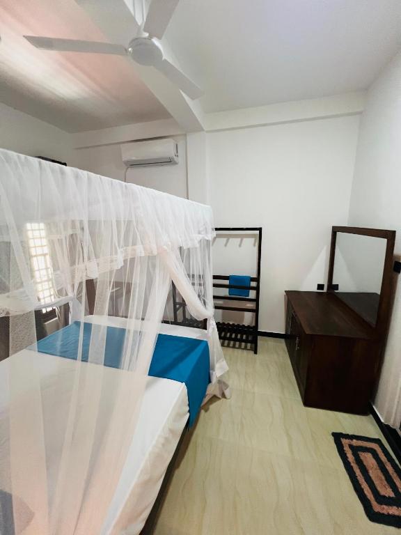 Postel nebo postele na pokoji v ubytování JO Residence - Tangalle