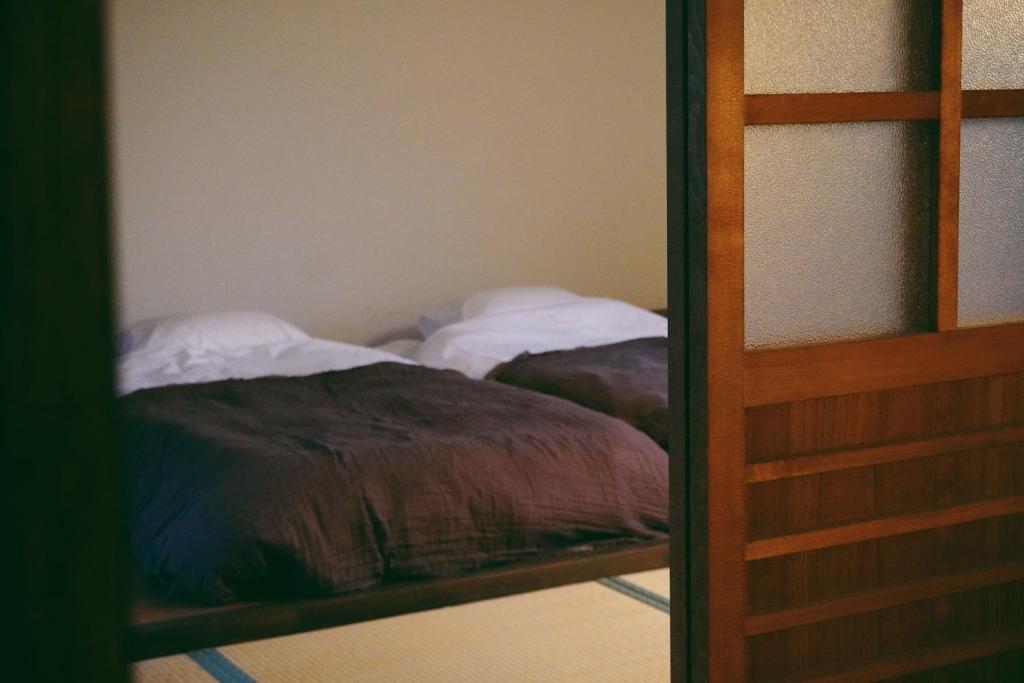Letto o letti in una camera di 余韻 奈良宿 - yoinn narayado