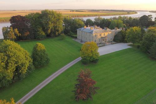 an aerial view of a large house on a green lawn at Saltmarshe Hall in Saltmarshe